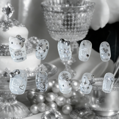 Silver Kitty press-on nails by MYOB Nails featuring silver chrome accents and iconic kitten silhouettes on a sheer white base.
