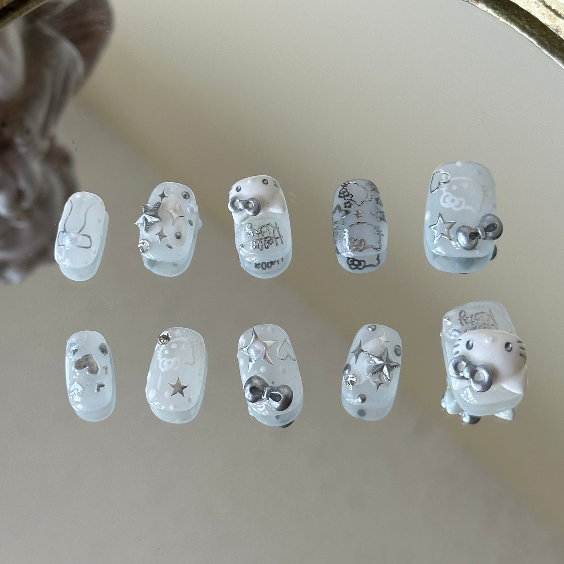 Back view highlighting the clean milk-glass sheer white base and the high-shine reflective silver finish.