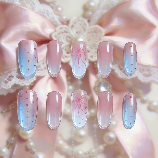 Softglow press-on nails by MYOB Nails featuring pink-white gradients with aurora powder and stamped bows.