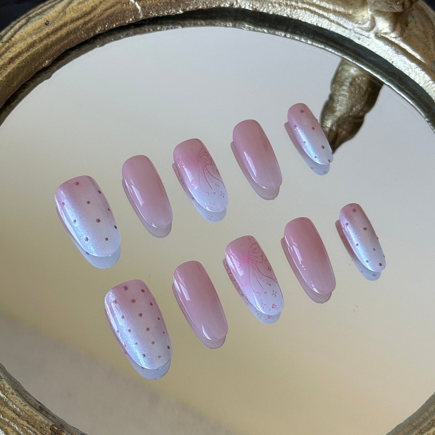 Close-up detail of the luminous white aurora powder over a soft pink-white gradient by MYOB Nails.