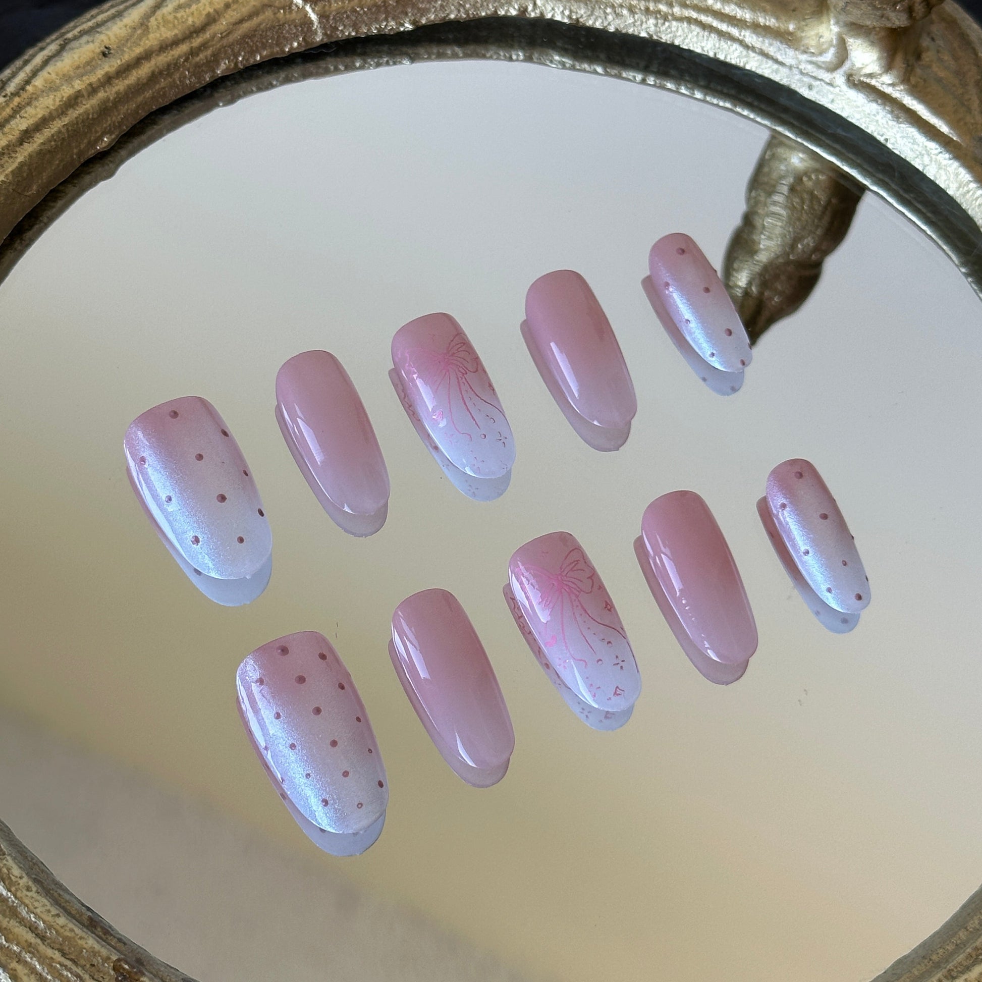 Close-up detail of the luminous white aurora powder over a soft pink-white gradient by MYOB Nails.