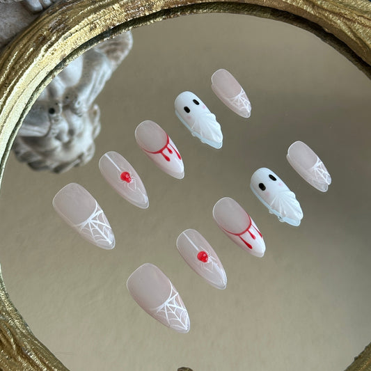Left side detail of MYOB Nails Spooky Webs set highlighting the realistic 3D crimson blood-drip and waterdrop effects.