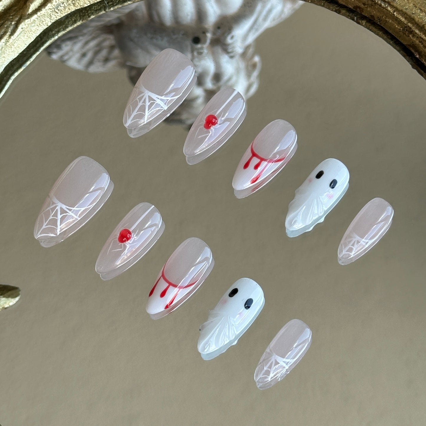 Right side view of Spooky Webs nails by MYOB Nails featuring the translucent and expressive 3D handcrafted ghost figures.