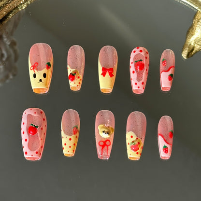 Front view of Strawbeary nails with silver shimmer base, irregular pink borders, and hand-painted cute elements.