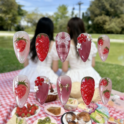 Strawberry Picnic press-on nails by MYOB Nails featuring 3D strawberries and red gingham patterns on a picnic background.