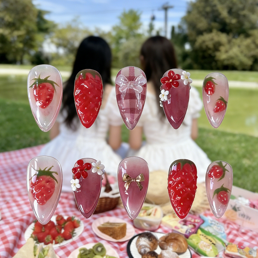 Strawberry Picnic press-on nails by MYOB Nails featuring 3D strawberries and red gingham patterns on a picnic background.