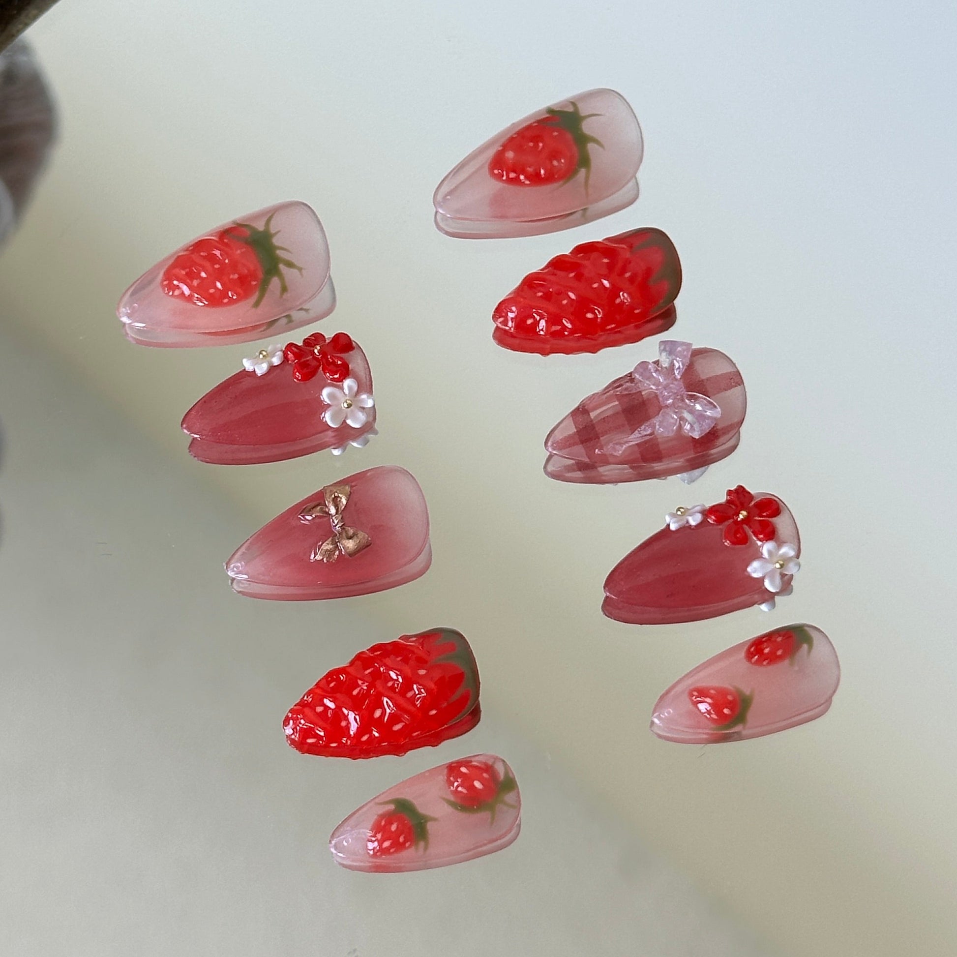 Right side view showcasing delicate white lace lines and tiny red bow accents on a sheer nude base.