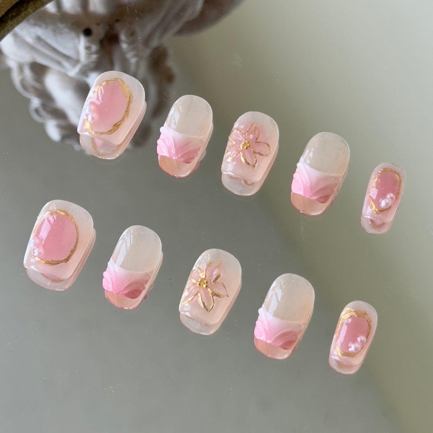 Front view of Sunblush nails showing the nude base, pink blush smudging, and delicate white French tips.