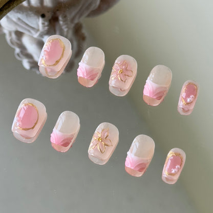 Front view of Sunblush nails showing the nude base, pink blush smudging, and delicate white French tips.