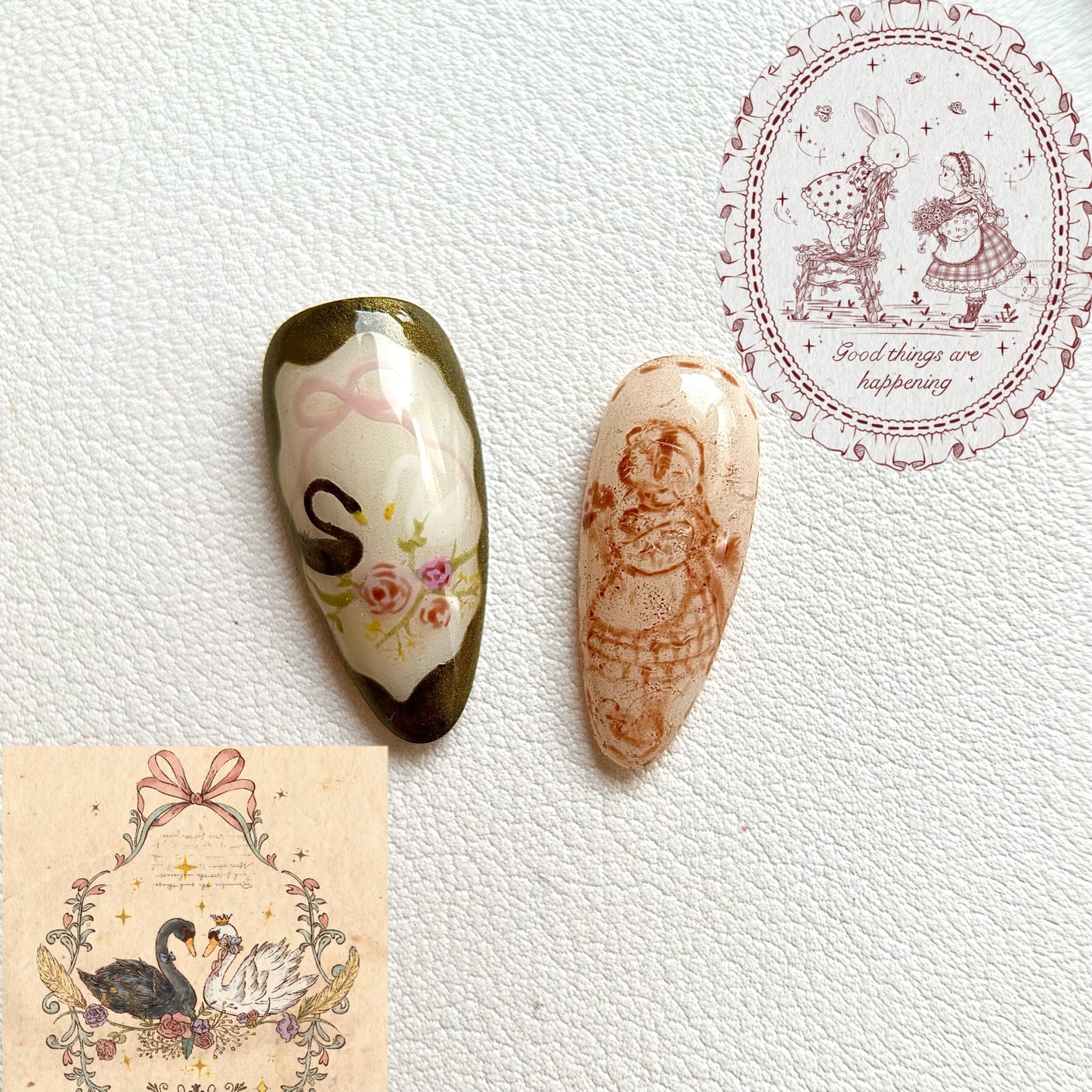 Close-up of MYOB Nails' handcrafted artistry, featuring a delicate hand-painted swan with a pink bow and a vintage-style portrait of a girl, showcasing intricate linework on a shimmering base.