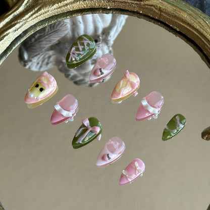 Right side view of Tiana nails by MYOB Nails showing the delicate 3D pink ribbon bows and soft pastel accents.