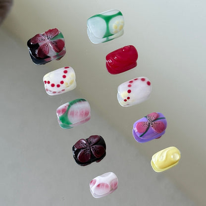 Side view showcasing transparent 3D water drops over green and pink blush ombre bases.