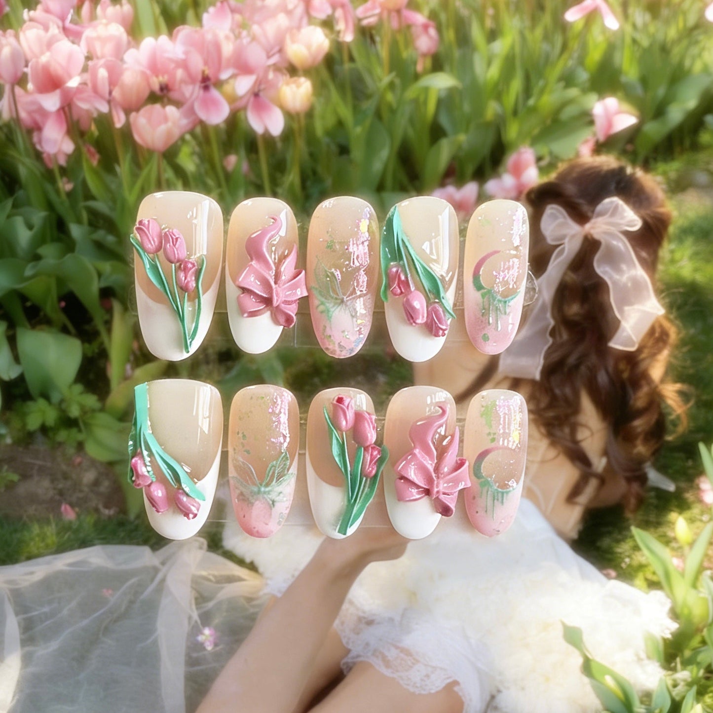 Tulip Whisper press-on nails by MYOB Nails featuring 3D sculpted tulips, pink bows, and embossed butterflies.