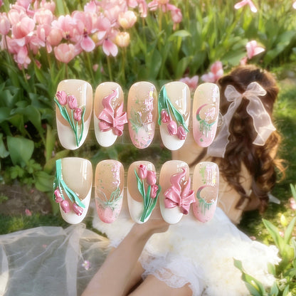 Tulip Whisper press-on nails by MYOB Nails featuring 3D sculpted tulips, pink bows, and embossed butterflies.