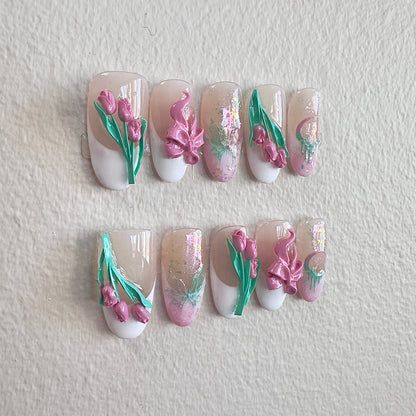 Close-up of the handcrafted 3D pink tulips and delicate ribbon bows on the Tulip Whisper set.