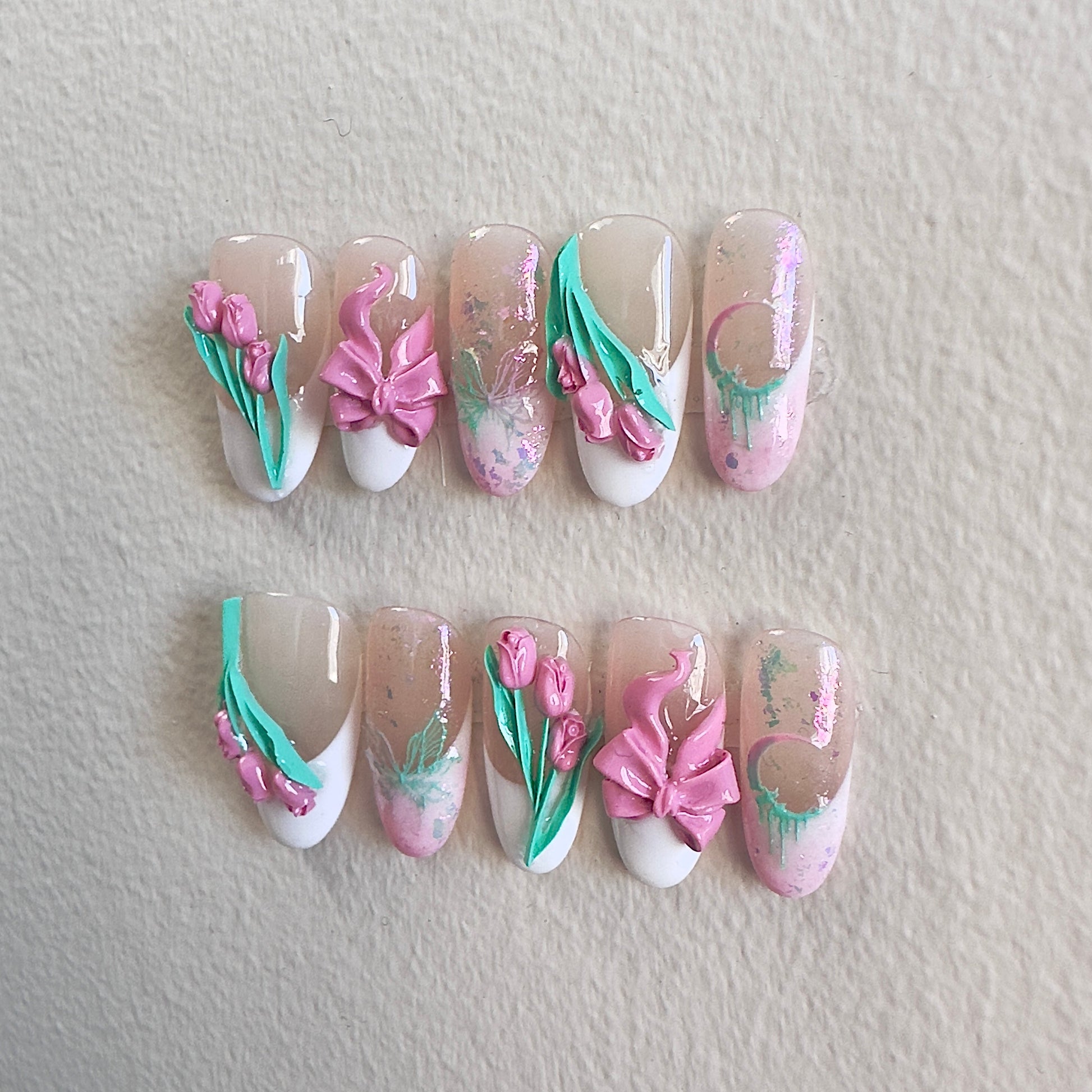 Side view highlighting the micro-embossed butterflies and the sparkling pink-green opal embellishments.