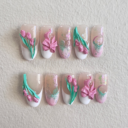 Front view of Tulip Whisper nails showing the sheer nude base, white French tips, and shimmering opal accents.