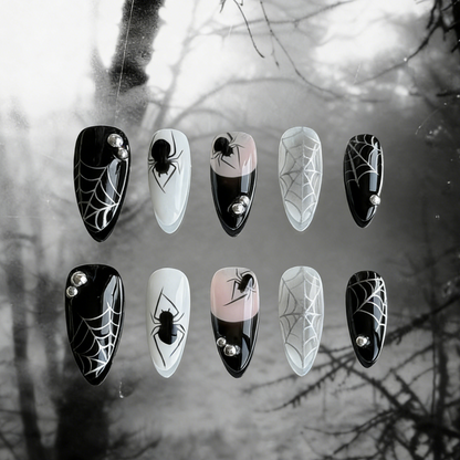 MYOB Nails' Web of Shadows press-on nails featuring gothic spider web patterns, spiders, and a moody foggy background.