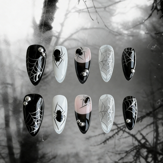 MYOB Nails' Web of Shadows press-on nails featuring gothic spider web patterns, spiders, and a moody foggy background.
