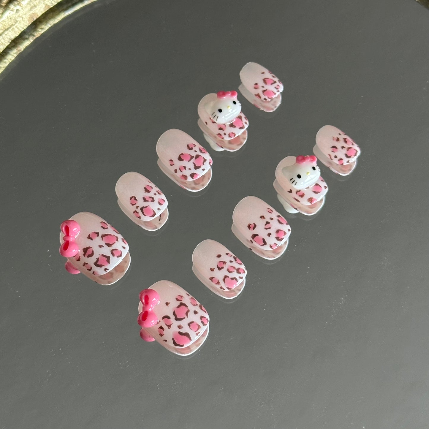 Left side view of Wild Kitty nails reflected in a mirror, showcasing the precision painting from MYOB Nails.