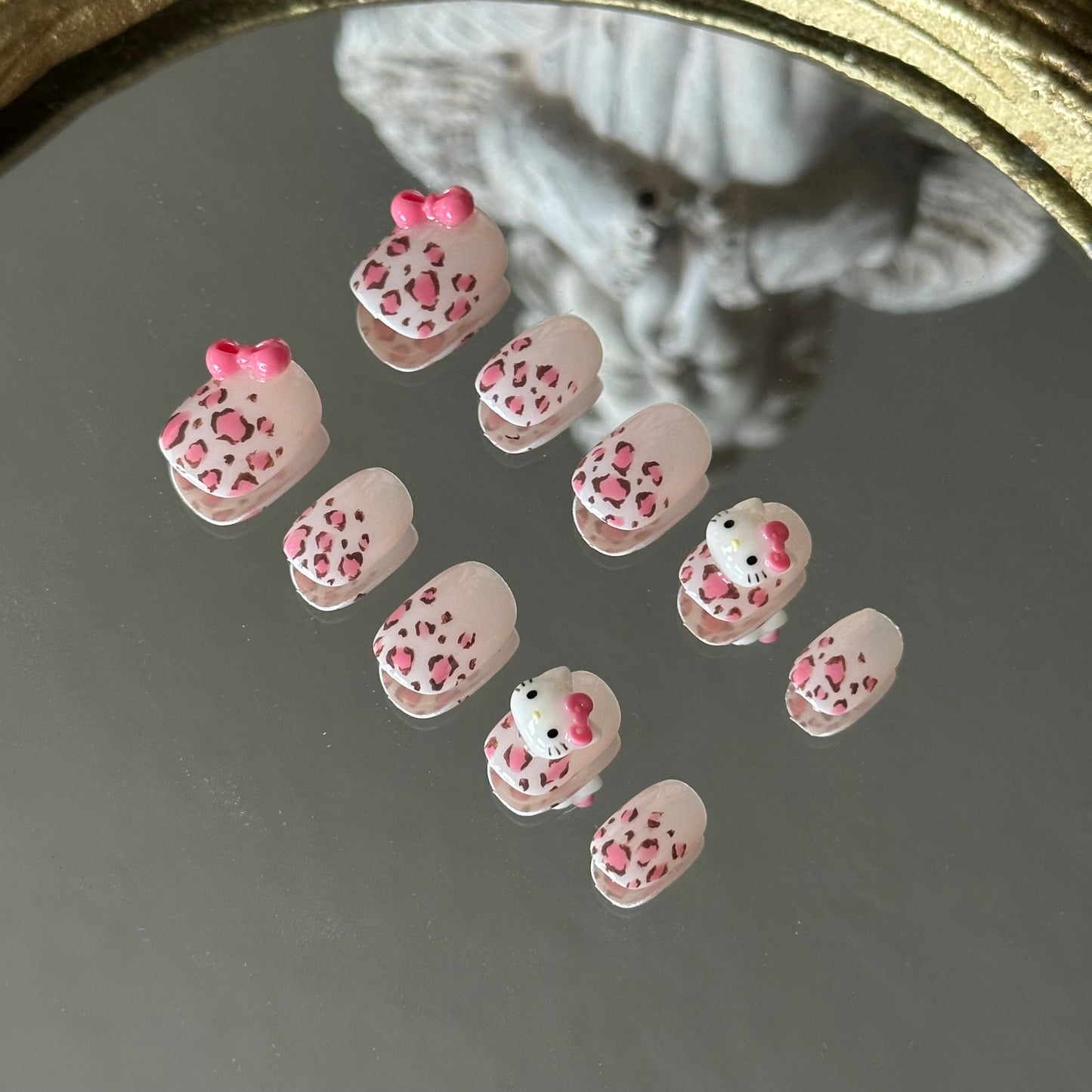 Right side mirror view of the Wild Kitty set, highlighting the durable 3D resin bow accents by MYOB Nails.