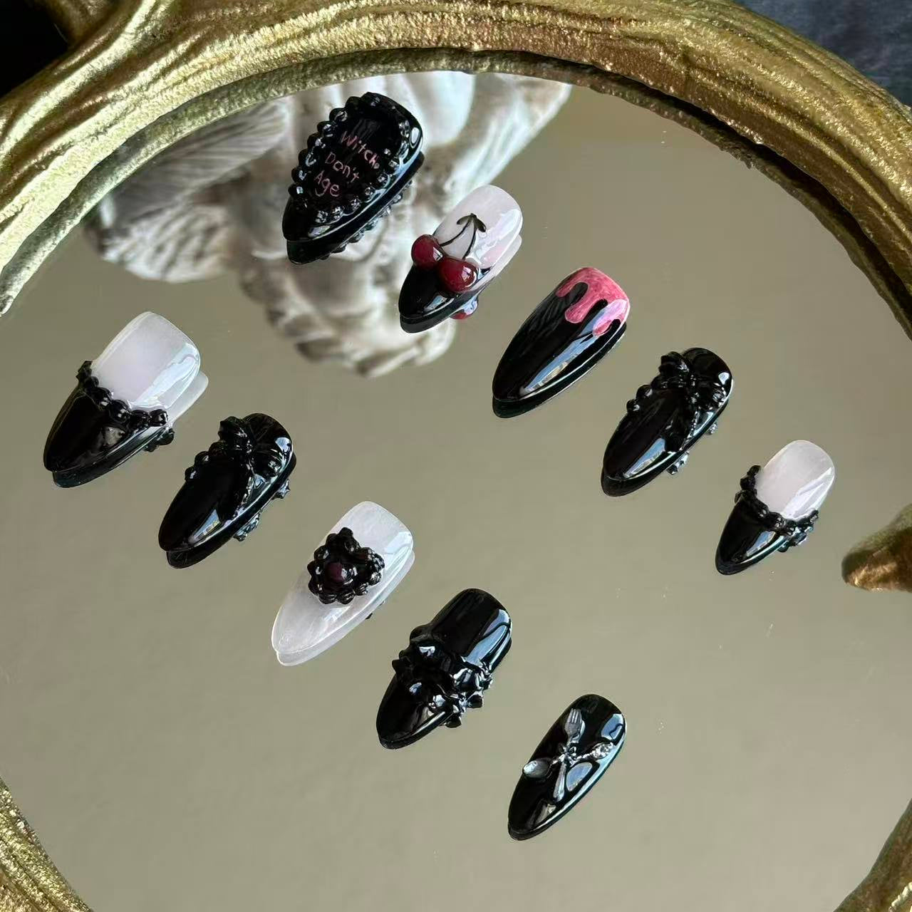 Right side view of Witches Don't Age nails by MYOB Nails showing the intricate 3D black relief and high-contrast white-to-black gradient.