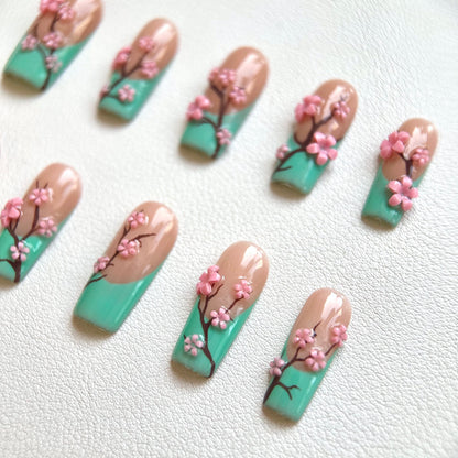 Side view highlighting the artistic hand-painted brown branches and the glossy top coat of the set.